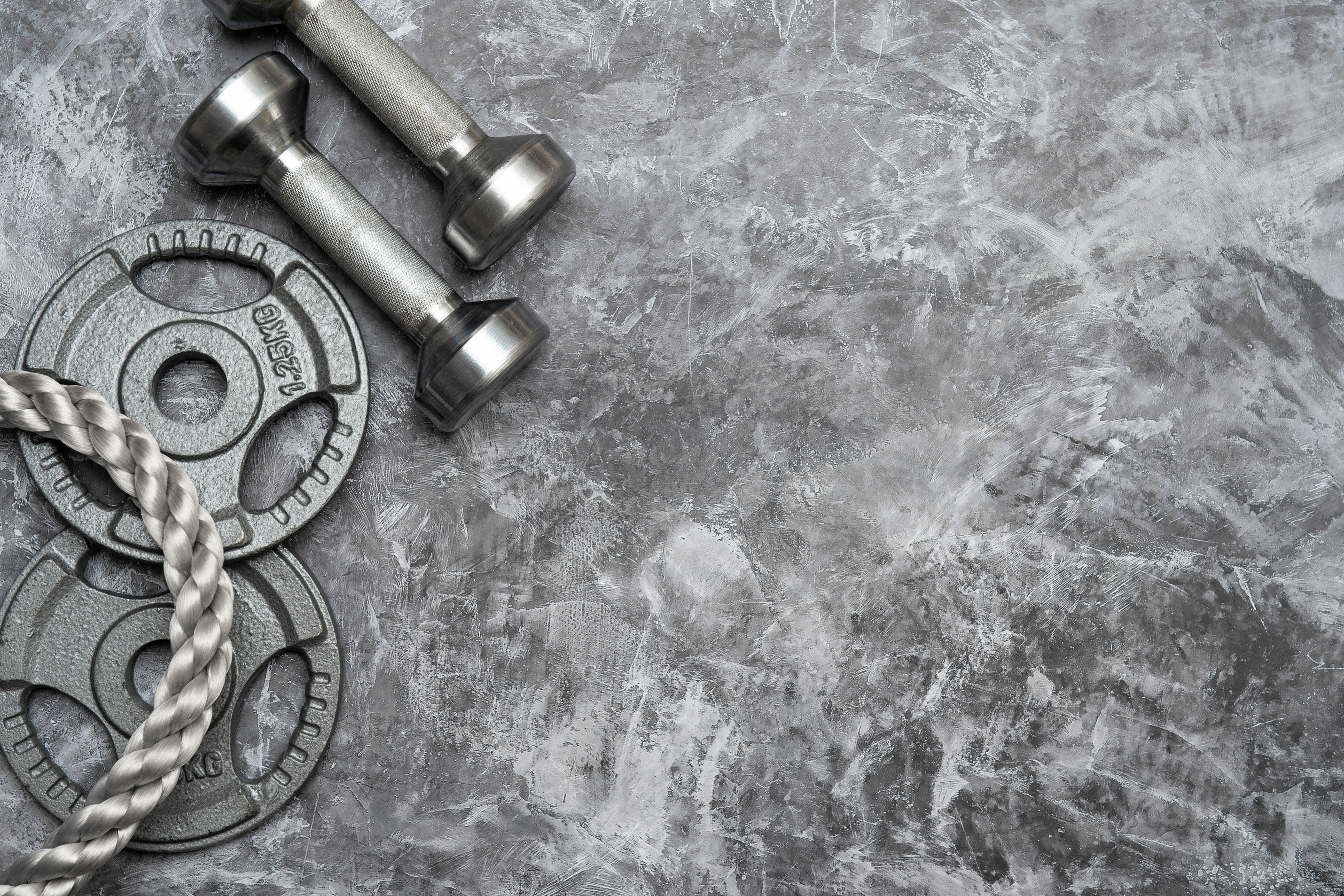 Gym Equipment on Stone Background 